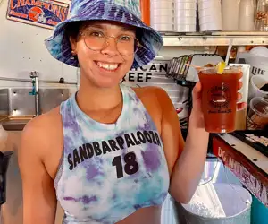 Sandbar girl with a Bloody Mary