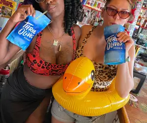 Sandbar bartenders with a Three Olives vodka puch at Mahi Mark's Pool Party