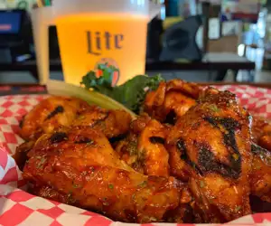 Basket of our Joey Style Wings and a pitcher of cold beer