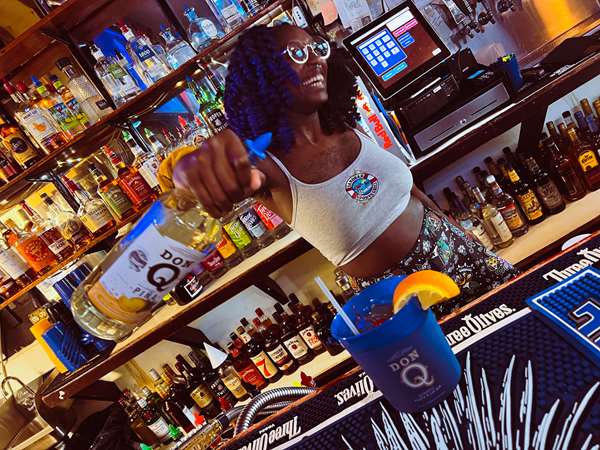 Bartender pouring drinks